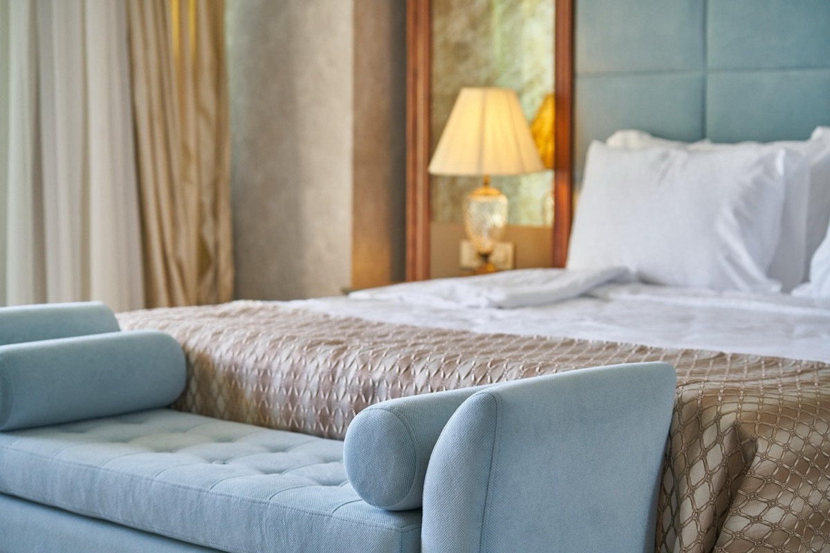 Hotel room with city view and wooden furniture