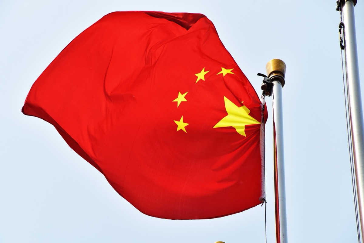 stock exchange hall with chinese flags
